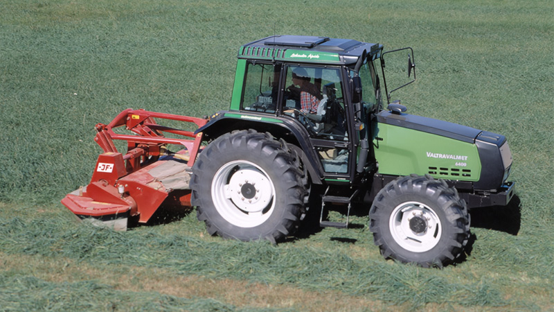 The Valtra Valmet 6400 seen here mowing using TwinTrac was first introduced in 1991